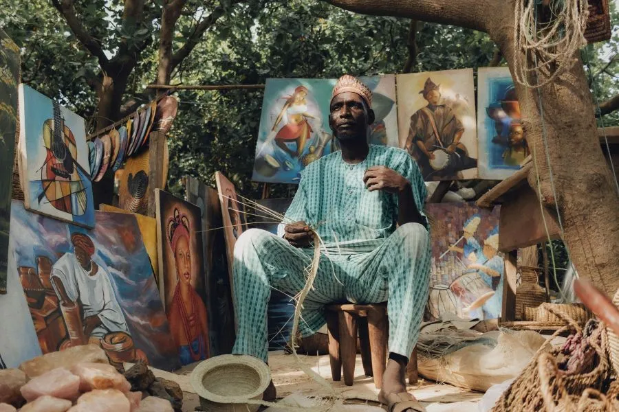 man at an informal market stall in nigeria